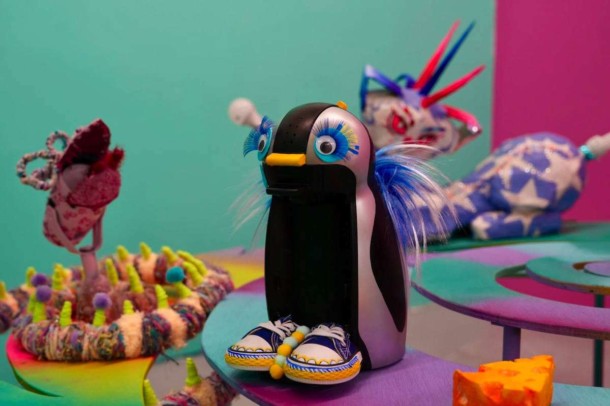 Qianquan Wang, 'Smart Penguin', reclaimed coffee machine, acrylic paint, plastic eyes, glitter EVA foam, synthetic eyelashes, canvas shoes, pom-poms and synthetic hair.